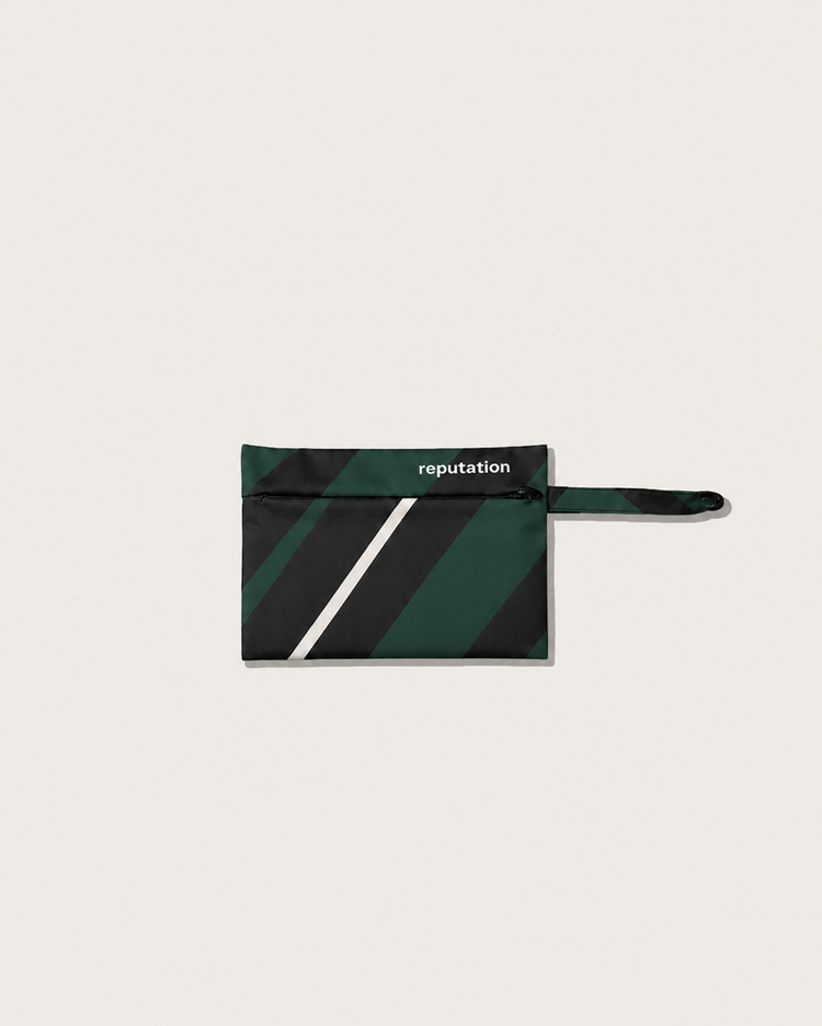 Reputation Vector print swimwear packaging pouch in green, flat lay